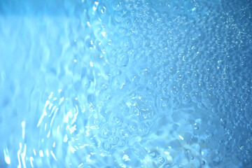 Blue water texture. Bubbles and bubbling water.