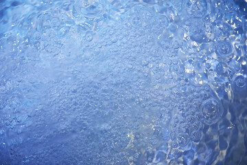 Blue water texture. Bubbles and bubbling water.
