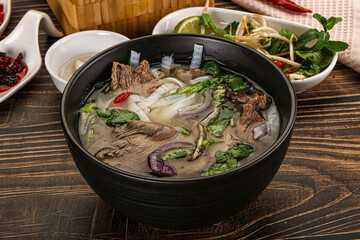 Vietnamese Pho Bo soup with beef and noodles