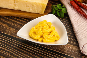 Yellow cheese sauce in the bowl