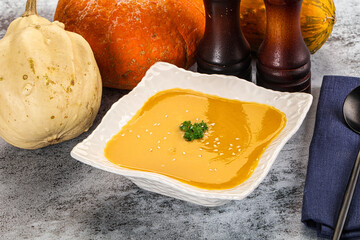 Vegan pumpkin cream soup served sesam