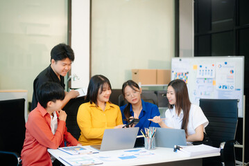 Business teamwork and collaboration among Asian professionals in a modern office