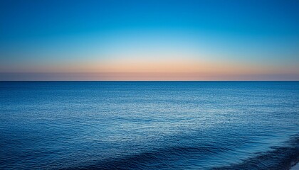Obraz premium atmospheric evening seascape.. seascape wallpaper. view from the shore as the vast, endless ocean meets the sky at the horizon