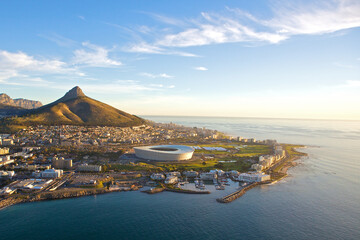 Aerial sunset view of the beautiful city of  Cape Town, South Africa, as seen from above. Table Mountain and Lions Head clearly visible in the background 