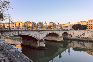 Obraz premium Rome in morning. Panoramic view of Ponte Sant Angelo Bridge in Rome with reflection in Tiber river
