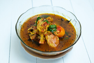 Indonesian food. Fish cooked in yellow sauce