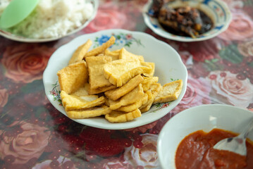 Fried tofu in a plate. Indonesian food