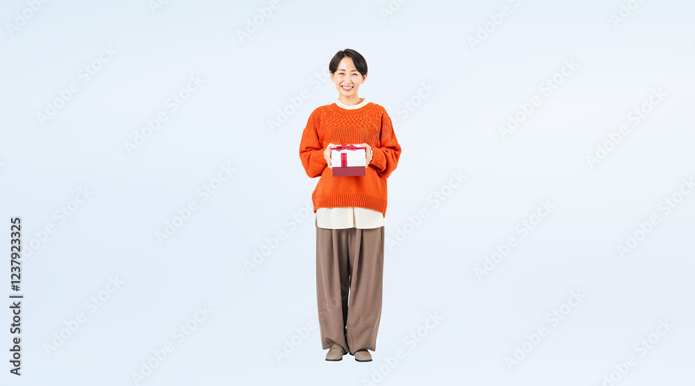 Aufkleber プレゼントを持つミドル女性の全身写真（切り抜き背景透過pngも販売しております。作成者リンクから「png」で検索してください）