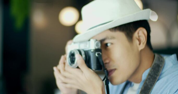 Young tourist using camera
