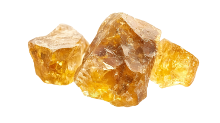 Gold nugget grains isolated against a white background