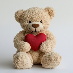 Obraz premium A teddy bear holding a small red heart, sitting on a white background for Saint Valentines Day