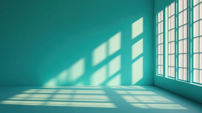 minimalist teal room with sunlight streaming through large windo