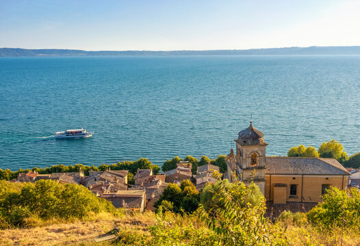 Lake Bracciano from village of Trevignano Romano with Church of Virgin Mary in Italy