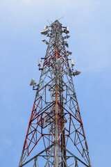Radio communication antenna on blue sky background. Telecommunication tower or Mobile phone tower