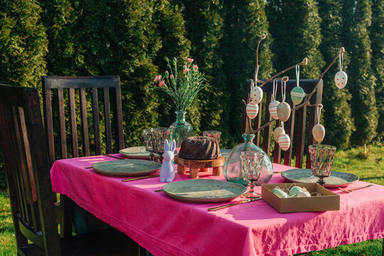 Easter decoration over dining table in back yard on sunny day