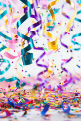 coloured confetti as a white New Year's background. AI generative.