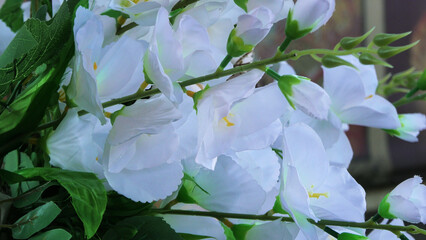 Artificial flower bouquets displayed in a handicraft shop