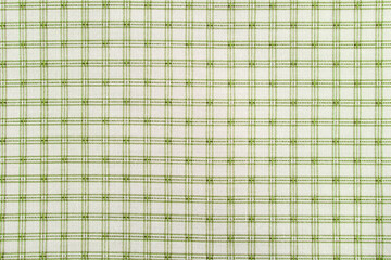 green checkered cotton fabric on white background close up