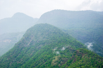 Breathtaking hills blanketed in rich greenery stretch across the landscape on the journey to Kodaikanal