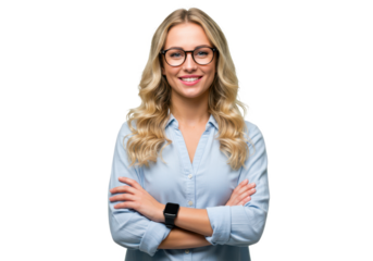 A blonde woman with wavy hair wearing glasses and a light blue shirt, standing with arms crossed and smiling