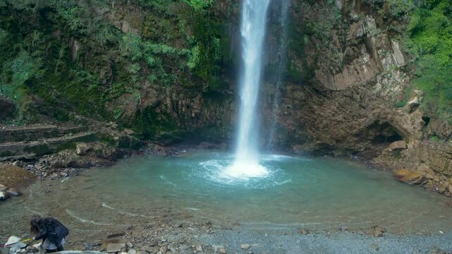 A natural waterfall in the Himalayas with crystal-clear water, nestled between dense forests and Himalayan mountains. Located in the Upper Himalayas, Uttarakhand, India, Tiger Fall near Mussoorie.