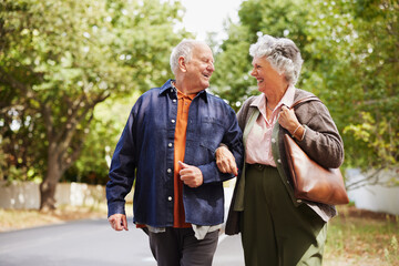 Happy elderly couple in love walking together outdoor