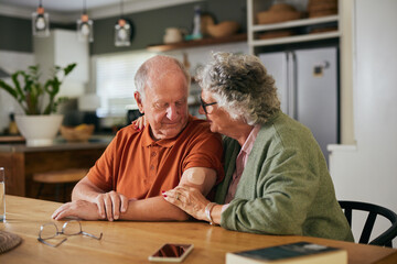 Senior couple discussing health about husband's diabetes