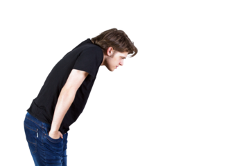 A man dressed in at-shirt and blue jeans, leaning forward in profile view. Isolated on a white background. Concept of curiosity or focus