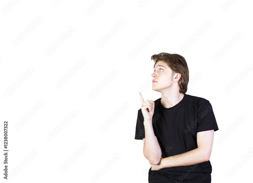 Poster young man in ashirt pointing upward with his index finger, looking thoughtful. isolated on a white b