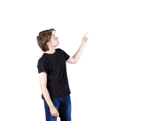 Young man wearingt-shirt and jeans pointing upward on white background. Isolated concept for advertising, presentation, or template