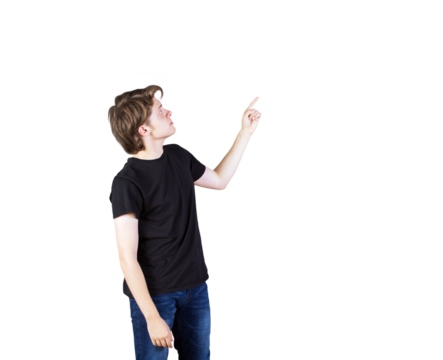 Young man wearingt-shirt and jeans pointing upward on white background. Isolated concept for advertising, presentation, or template