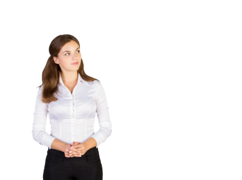 Young woman in a white blouse andpants standing with clasped hands, looking to the side, isolated on a white background, concept of professionalism