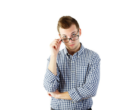 A young man wearing a blue checkered shirt, adjusting his glasses, isolated on a white background. Concept of thoughtful or inquisitive expression