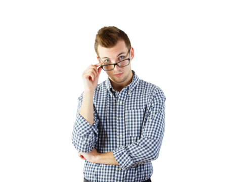 A young man wearing a blue checkered shirt, adjusting his glasses, isolated on a white background. Concept of thoughtful or inquisitive expression