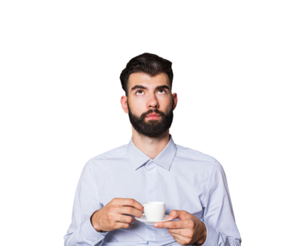 Bearded man in a light shirt holding a small coffee cup, looking upwards. Isolated on a white background. Concept of contemplation or ideas