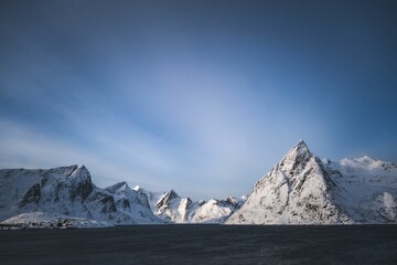 Snowy mountains under clear blue sky