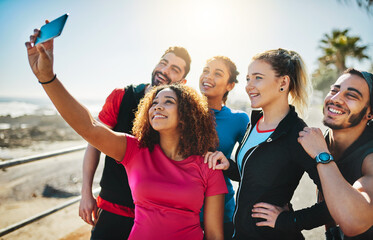 Fitness, selfie and group of happy friends in nature to post picture for wellness, health and workout on social media. Exercise team, people and photo together for memory, sports or training at beach