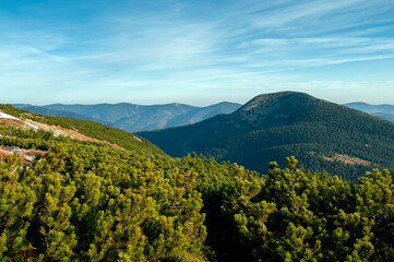 beautiful mountain valleys and mountains on a bright sunny day on the background of a wide valley