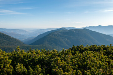 beautiful mountain valleys and mountains on a bright sunny day on the background of a wide valley