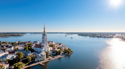 Aerial view of cathedral by lake, sunny day, city skyline