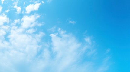 Obraz premium Serene Blue Sky with Fluffy White Clouds Background Image