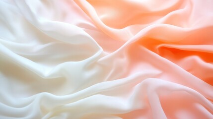 Fototapeta premium Peach and cream fabric draped softly, studio background, ombre effect, ideal for fashion or design