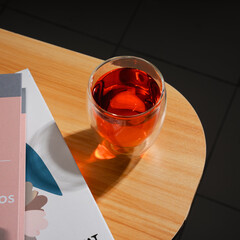 Glasses of cognac, brandy, and whiskey on a table with book