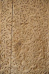 Ancient carving on a wooden door in Khiva closeup , Uzbekistan, Asia