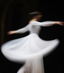 Fototapeta premium Graceful Easter Elegance Ethereal Dance Motion in White on Dark Church Canvas - Spring Holiday Imagery for Cultural Marketing and Artful Event Ambiance