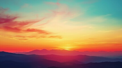 Obraz premium Serene Sunset Over Mountain Range with Colorful Sky and Clouds