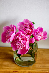 spring flowers, bouquet of pink peonies, pink peonies in a glass vase