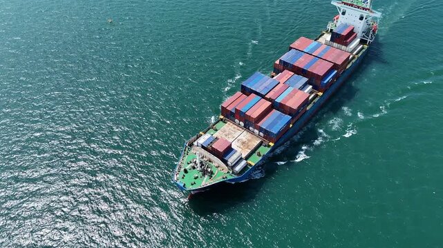 Aerial top view of cargo ship carrying container and running for export cargo yard port to custom ocean concept technology transportation , customs clearance,