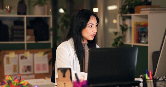 Reading, online and computer with business asian woman in office for art director, media campaign and overtime. Client feedback, email and deadline with person in creative agency at night for editor