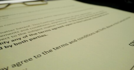 A man puts his signature on behalf of a company representative, close-up of his signature, an unrecognizable person